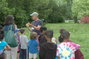 Grounds Manager Lloyd Guindon engages elementary students from Friends' Central School - click to enlarge